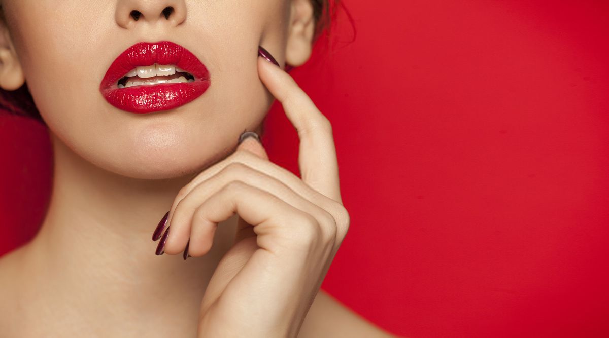 Medspa model with red lipstick